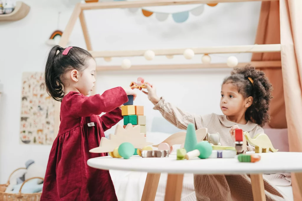 Girls playing with blocks in a child-friendly vacation home.